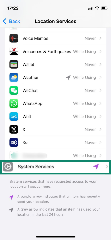 The Location Services settings page of an iPhone, with the System Services button highlighted.